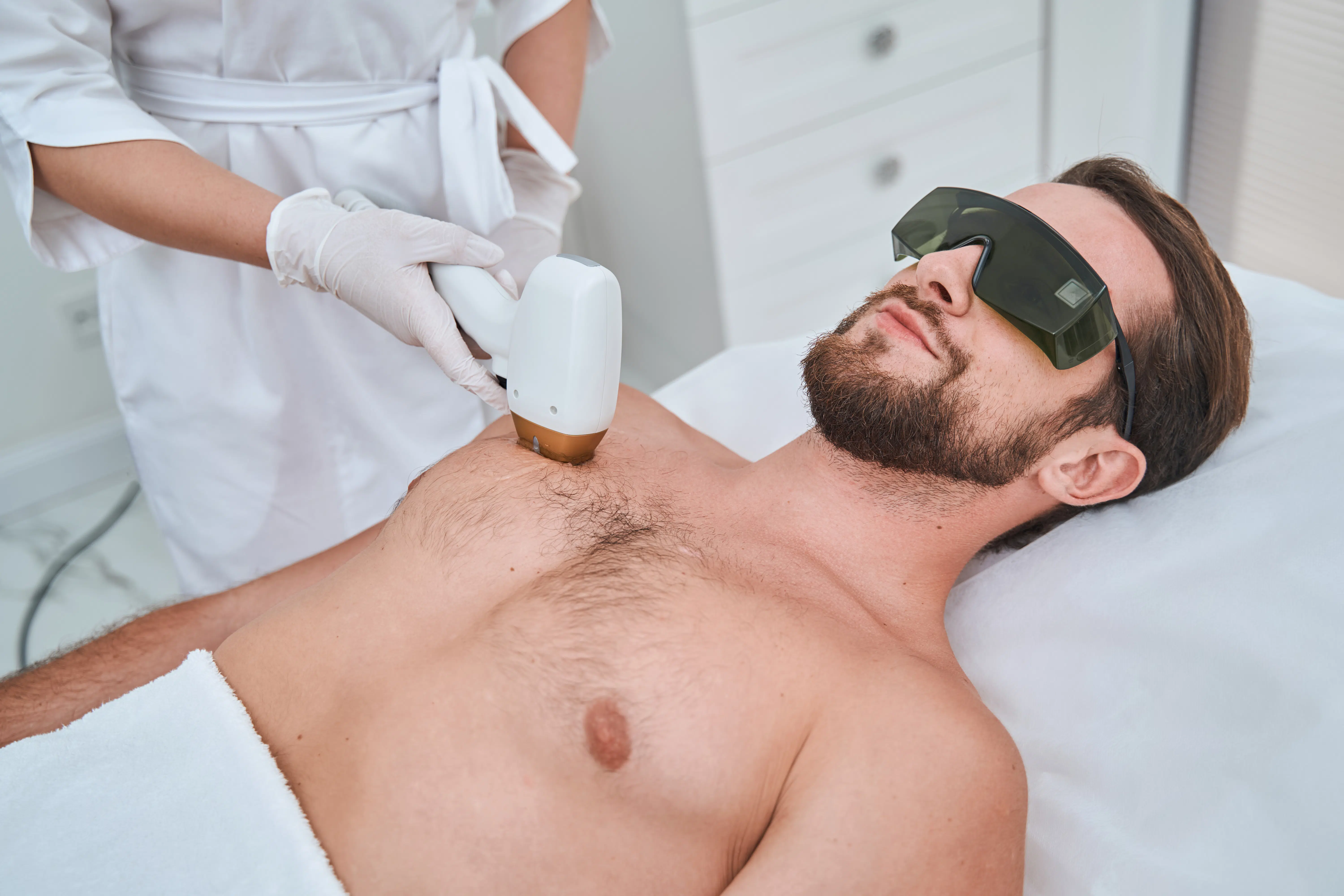 Spa client undergoing a medical procedure performed by a dermatologist